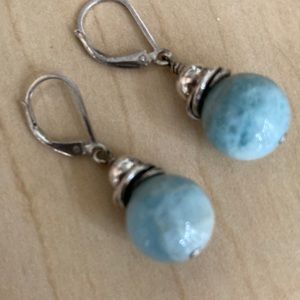 Sterling silver and blue stone hanging earrings.